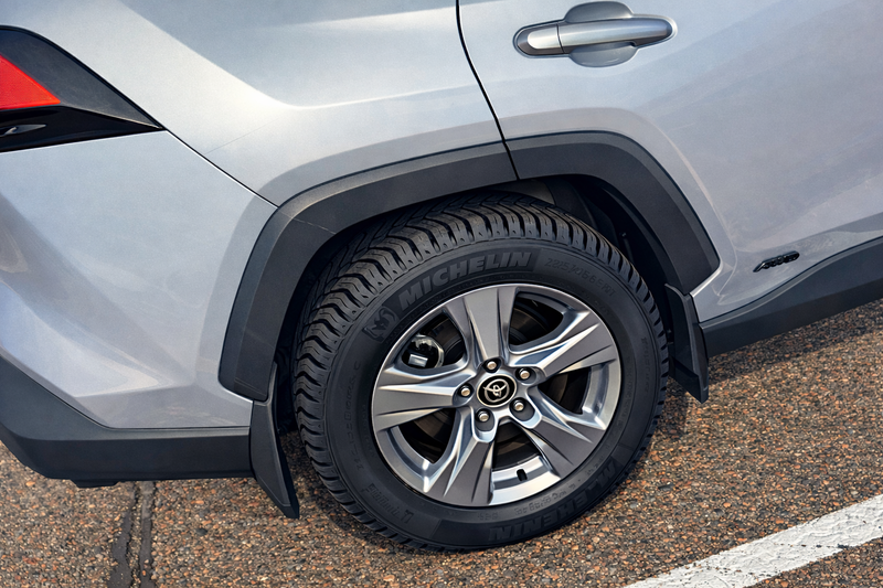 Car tire with Michelin branding on a road